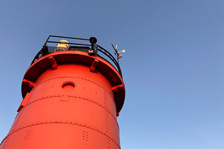 Looking up at the iconic red South Haven Lighthouse